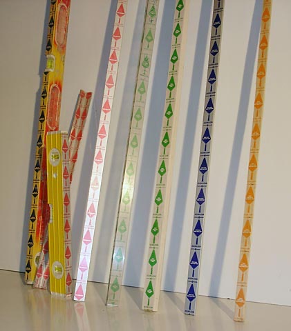 Old brick rulers next to color-coded KwikTape story poles